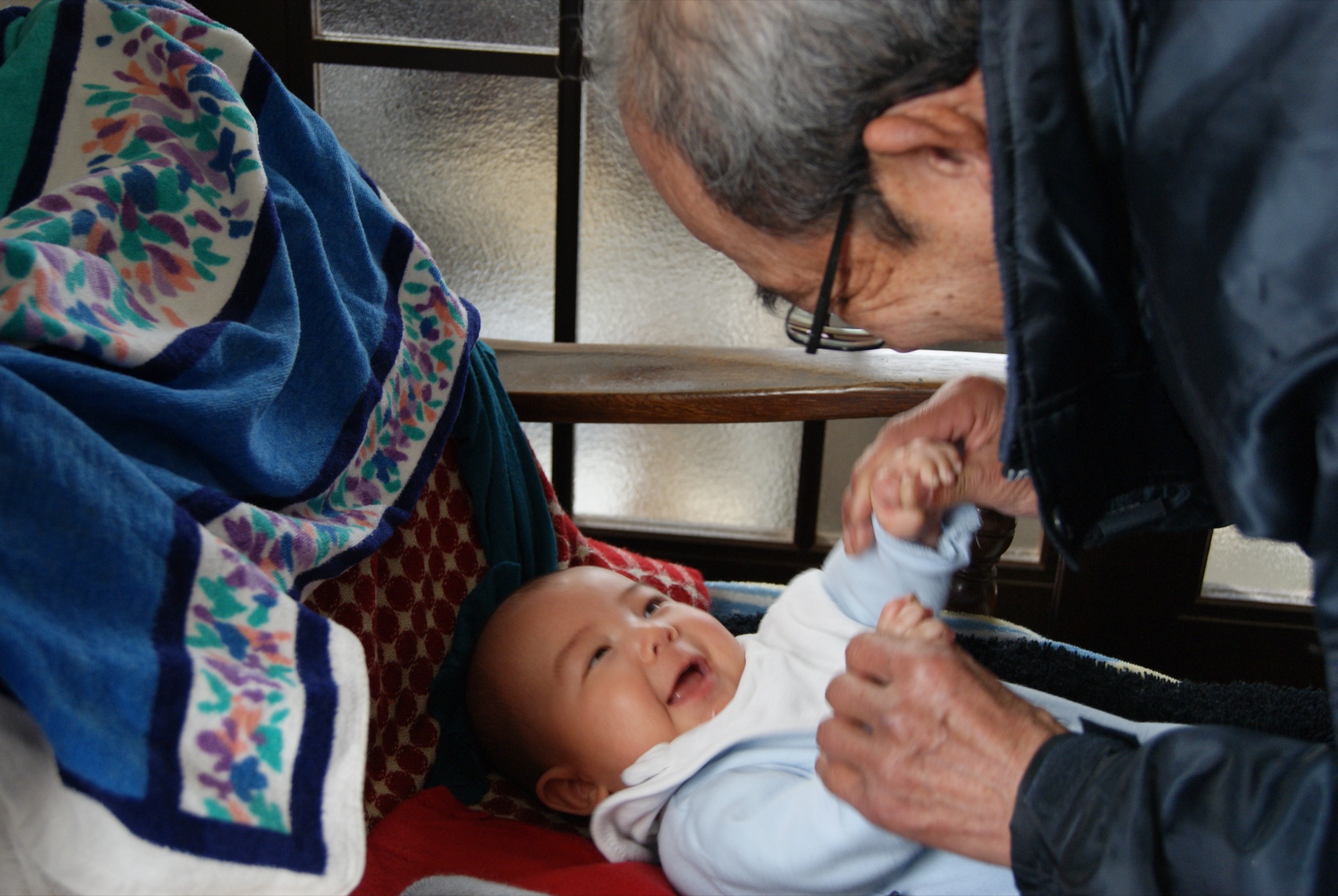Jiji playing with baby Kai